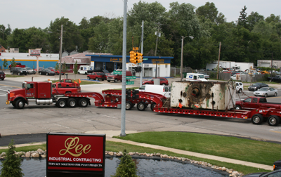 Machinery mover bringing in equipment - Lee Machinery Movers
